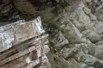 Close-up of stratified rock deposits in the open air.