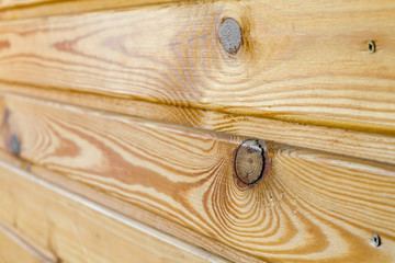 Background of natural wooden planks on the same surface with elements of knots