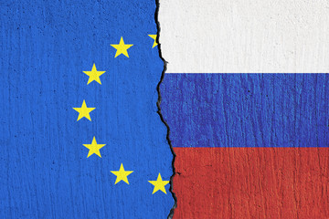 flag of the European Union and the flag of Russia painted on  wall -