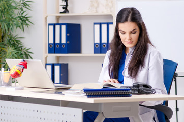 Female doctor cardiologist working in the clinic 