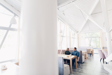boyfriend and girlfriend enjoy each other indoor. Together forever.  Loving Couple on the date in cafe. Happy couple drinking coffee.love story concept