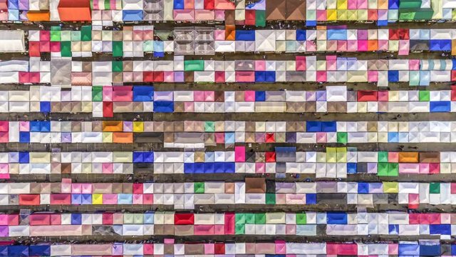 aerial top view train night market ratchada multi color beautiful abstract art time lapse view in bangkok, bangkok market, thailand.