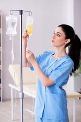 Young female doctor in infusion concept 