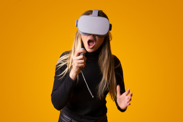 young girl with surprise face using virtual reality glasses