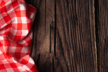 red tablecloth on wooden