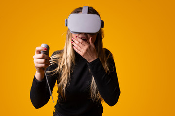 young girl with worried face using virtual reality glasses