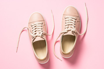 Pink shoes on pink top view.
