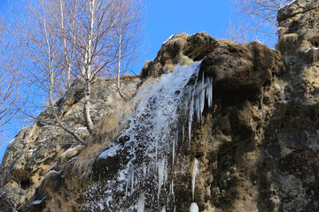 Honey waterfalls flowing between a caucasus mountains of North Caucas, Russian Federation 
