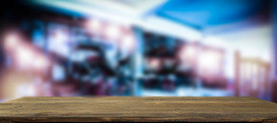 Table background of free space for your decoration and blurred bar. Night Club interior. 