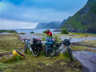Cyclists stopped to rest on the fjord in Norway.
