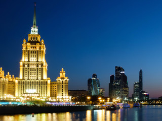 Obraz premium Moscow, Russia - 30 April 2019. Illuminated facade of The Hotel Ukraina, Radisson Collection hotel, one of seven stalinism skyscrapers also known as Seven Sisters