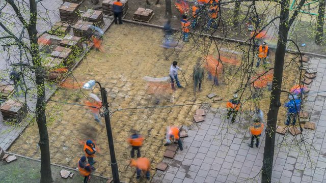 Road workers dismantled tile pavement, time lapse