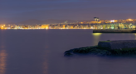 Fototapeta na wymiar Beautiful misty cityscape night view of Thessaloniki