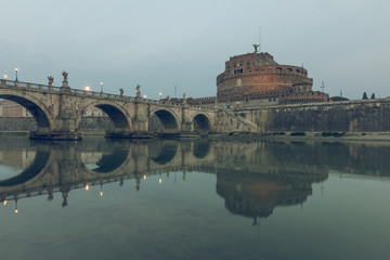 River Tiber in the historic center of Rome with the Aurelius bridge over waters with Castel Sant...