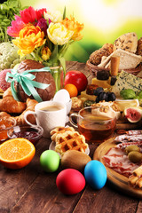 Obraz na płótnie Canvas breakfast on table with bread buns, croissants, coffe and eggs