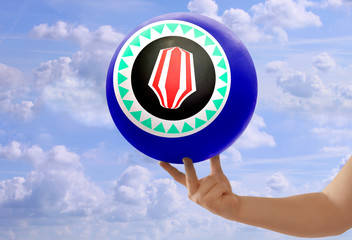 National blue flag of the state of bougainville on a round globe, with a red and white pattern on a...
