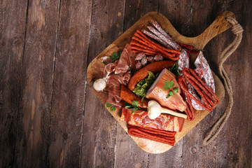 Variety of meat products including ham and sausages.