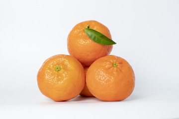 Tangerines with leaves on a white background