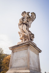 Fototapeta na wymiar Angel statue on the sunny sky of Rome