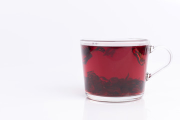 hibiscus tea in the glass cup isolated on white background