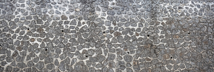 Texture of a rubble wall, typical construction of the Reunion house used as a retaining wall or fence between the houses