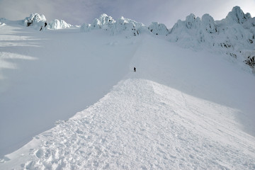 Snow covered terrain on Mount Hood, a volcano in the Cascade Mountains in Oregon popular for hiking, climbing, snowboarding and skiing, despite risks of avalanche, crevasses and weather on the peak. © nyker