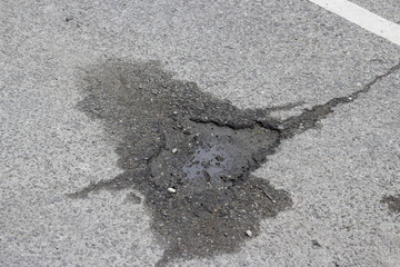 pothole in the middle of the road