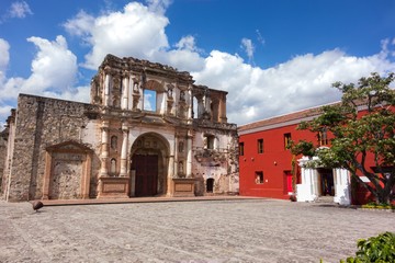 Spanish Colonial Architecture Ruins and Courtyard in front of Ibero American Center for Spanish Cooperation in Old City Antigua, a UNESCO World Heritage Site in Guatemala - obrazy, fototapety, plakaty