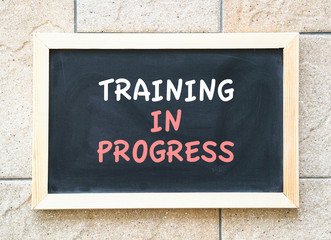 Training in progress, words on a blackboard'