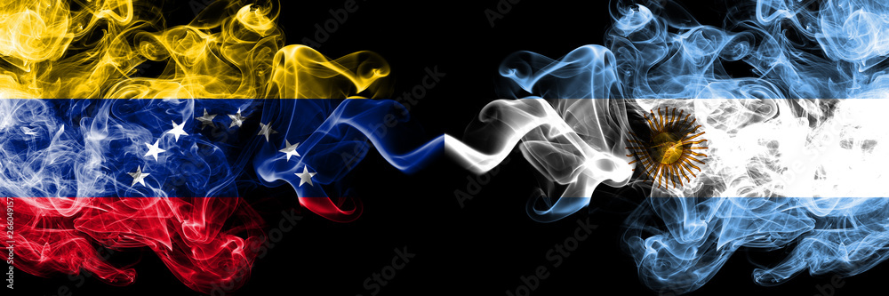 Wall mural Venezuela vs Argentina, Argentinian smoky mystic flags placed side by side. Thick colored silky smoke flags of Venezuela and Argentina, Argentinian