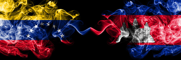 Venezuela vs Cambodia, Cambodian smoky mystic flags placed side by side. Thick colored silky smoke flags of Venezuela and Cambodia, Cambodian