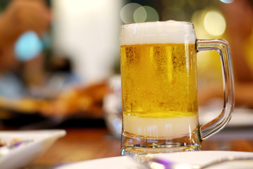 Close up of the cold glass beer with froth. Good view of Pub & restaurant concept.