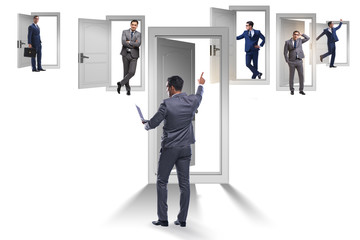Fototapeta premium Businessman in uncertainty concept with many doors