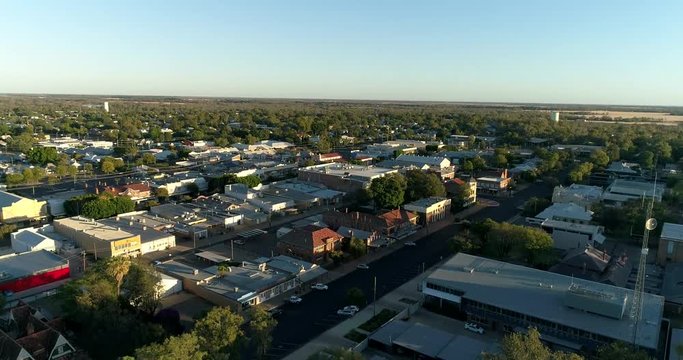 Intersection of main shopping street in Moree town &ndash; top down view lifting up along the street to horizon and sky.