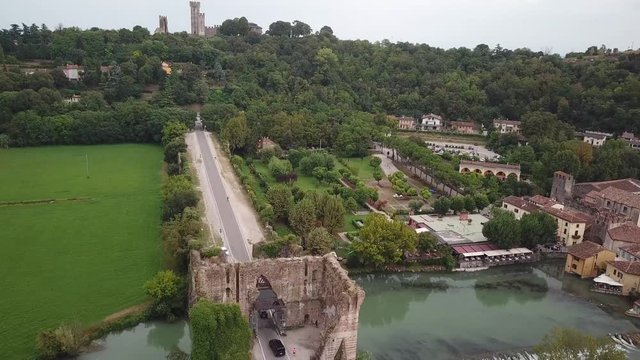 Valeggio sul Mincio aerial view of the Borgo famous Visconti bridge over the river and medieval Gothic castle