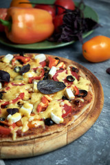 Slice of hot pizza large cheese lunch or dinner crust seafood meat topping sauce. with bell pepper vegetables delicious tasty fast food italian traditional on wooden board table classic in view