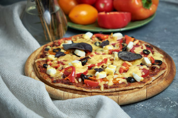 Slice of hot pizza large cheese lunch or dinner crust seafood meat topping sauce. with bell pepper...