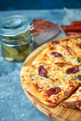 Slice of hot pizza large cheese lunch or dinner crust seafood meat topping sauce. with bell pepper vegetables delicious tasty fast food italian traditional on wooden board table classic in view
