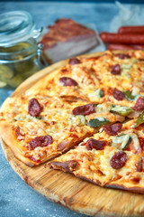 Slice of hot pizza large cheese lunch or dinner crust seafood meat topping sauce. with bell pepper vegetables delicious tasty fast food italian traditional on wooden board table classic in view