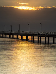 Fototapeta na wymiar Pier Morning Seaside Sunrise