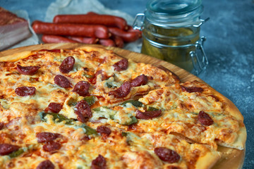 Slice of hot pizza large cheese lunch or dinner crust seafood meat topping sauce. with bell pepper vegetables delicious tasty fast food italian traditional on wooden board table classic in view