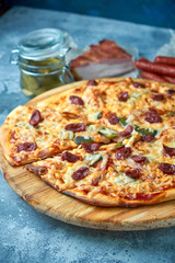 Slice of hot pizza large cheese lunch or dinner crust seafood meat topping sauce. with bell pepper vegetables delicious tasty fast food italian traditional on wooden board table classic in view