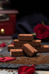 Chocolates and roses on the table