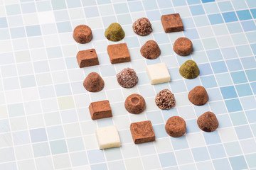 Chocolates and roses on the table