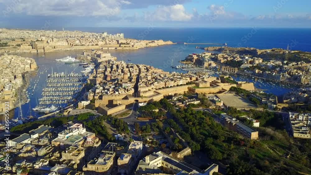 Wall mural birgu and senglea aerial view with la valletta of malta in the background on a sunny winter afternoo