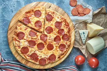 Slice of hot pizza large cheese lunch or dinner crust seafood meat topping sauce. with bell pepper...