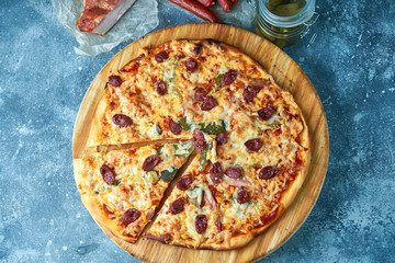 Slice of hot pizza large cheese lunch or dinner crust seafood meat topping sauce. with bell pepper vegetables delicious tasty fast food italian traditional on wooden board table classic in view