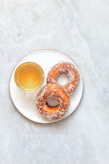 Finnish traditional Vappu food 1st of May, sugar donuts with sima on marble background with copy space