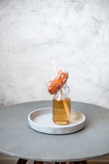 Finnish traditional Vappu food 1st of May, sugar donuts with sima on marble background with copy space