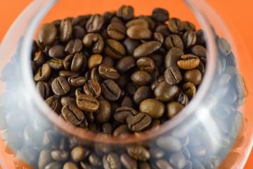 Close-up view of coffee beans in a glass . Horizontal photography